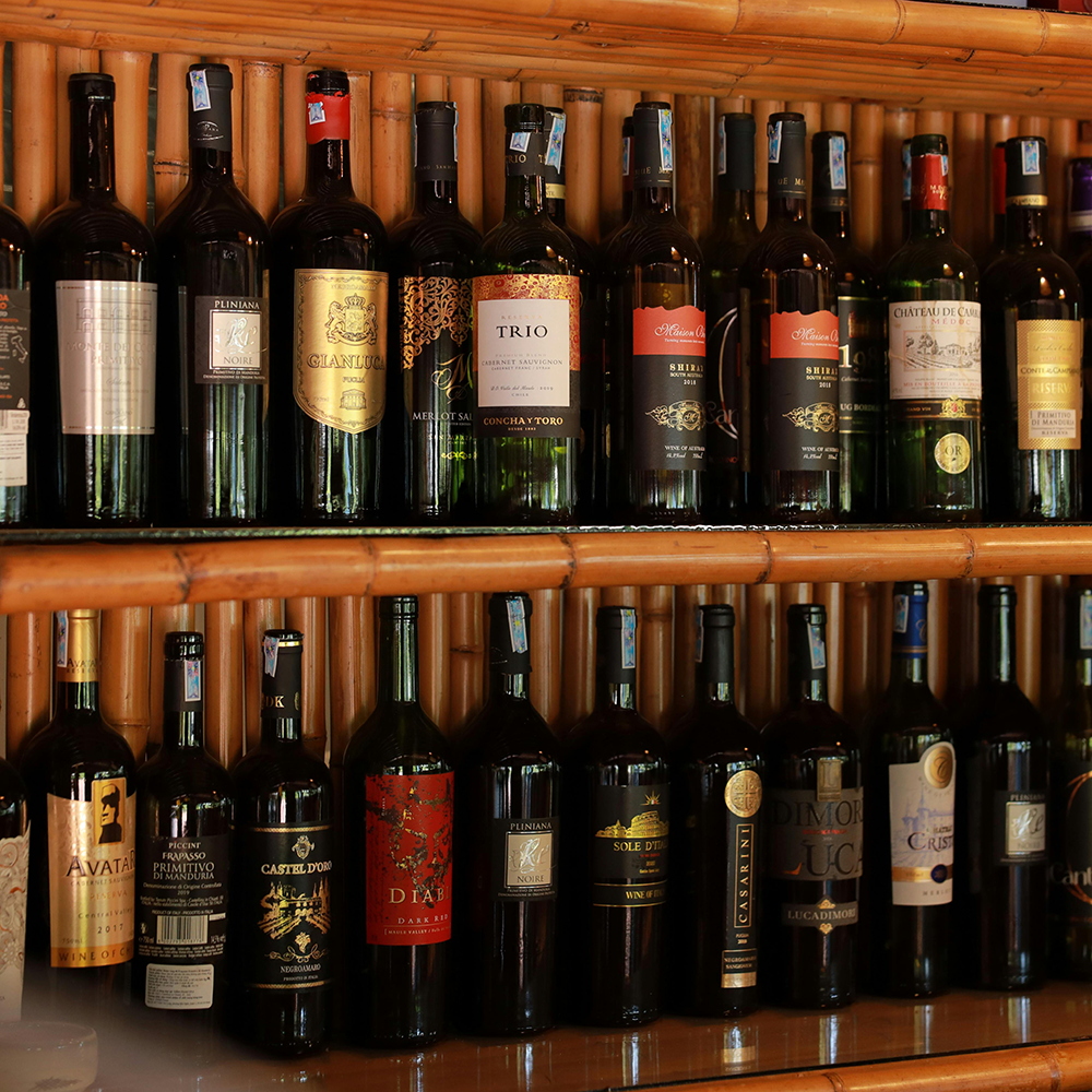 various wine bottles displayed on a shelf