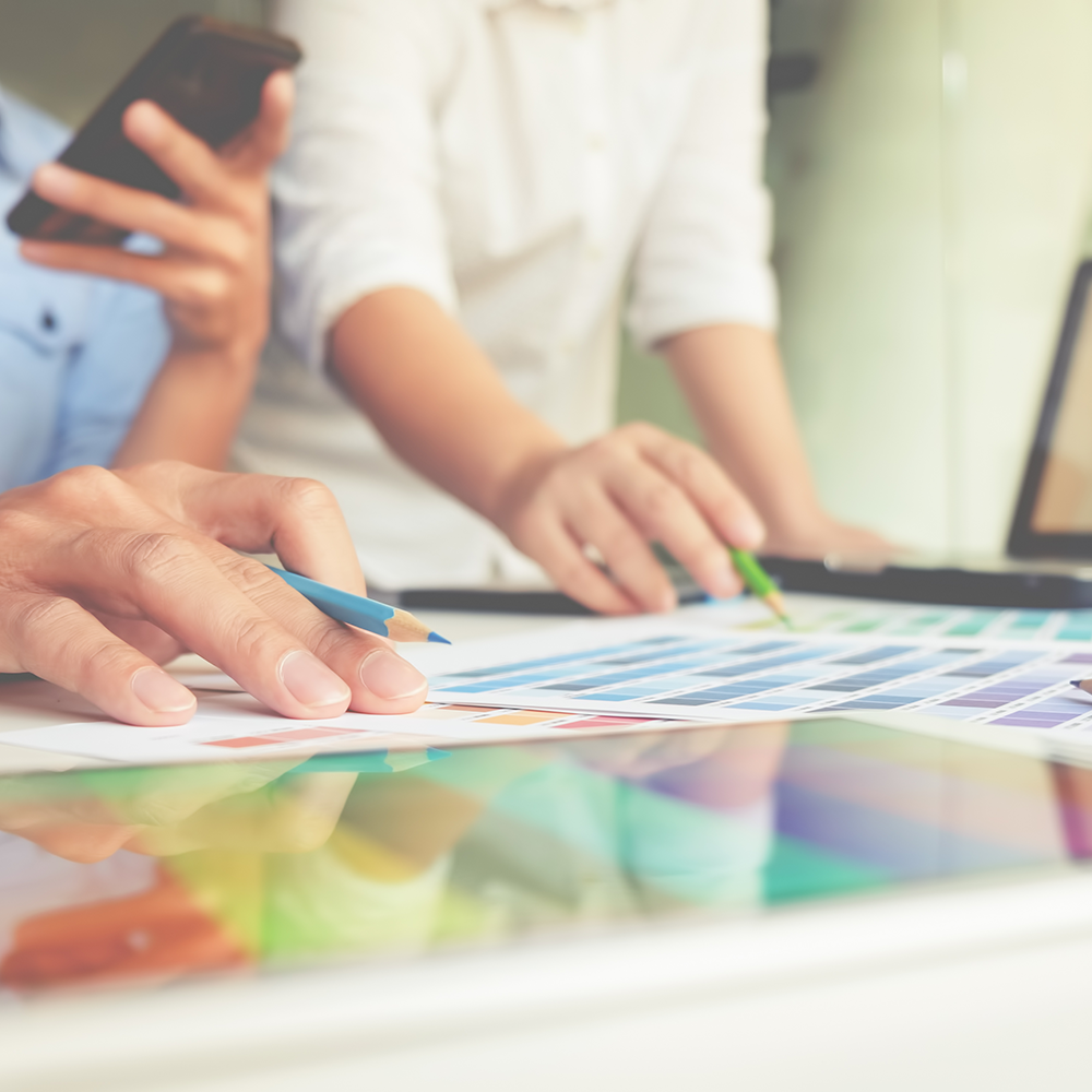 people working on custom label design